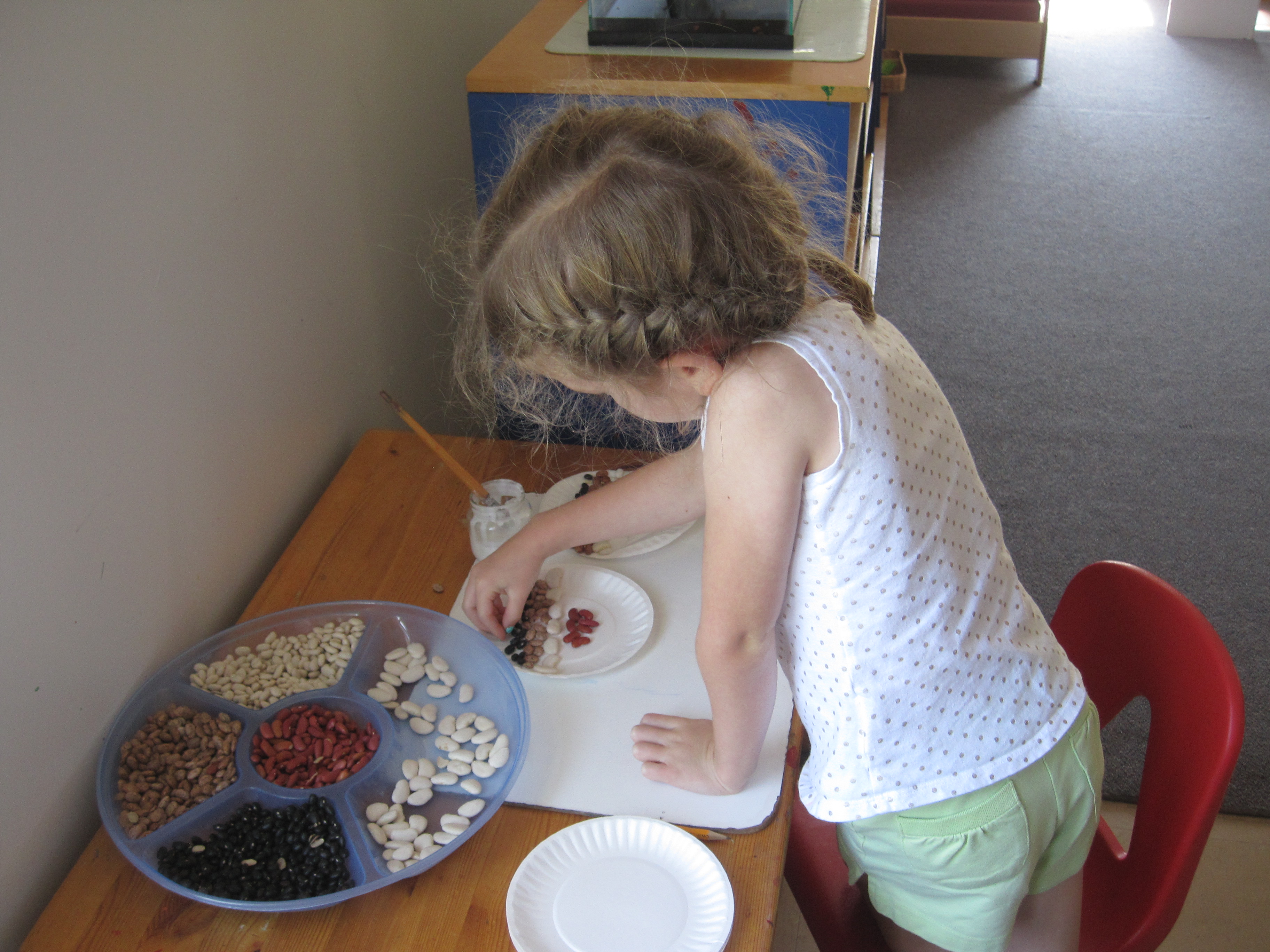 Child exploring a Montessori Work